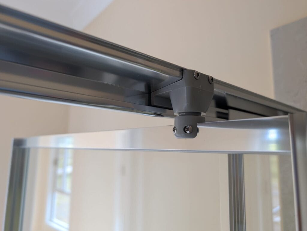 Framed shower door pivot bracket