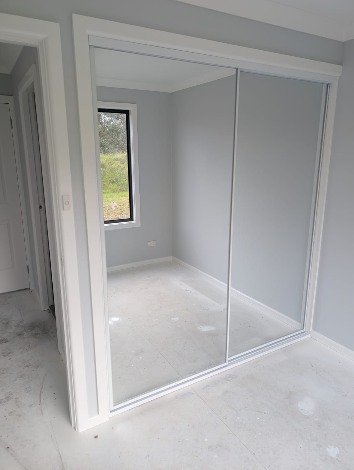 Sliding mirror wardrobe doors with white frames