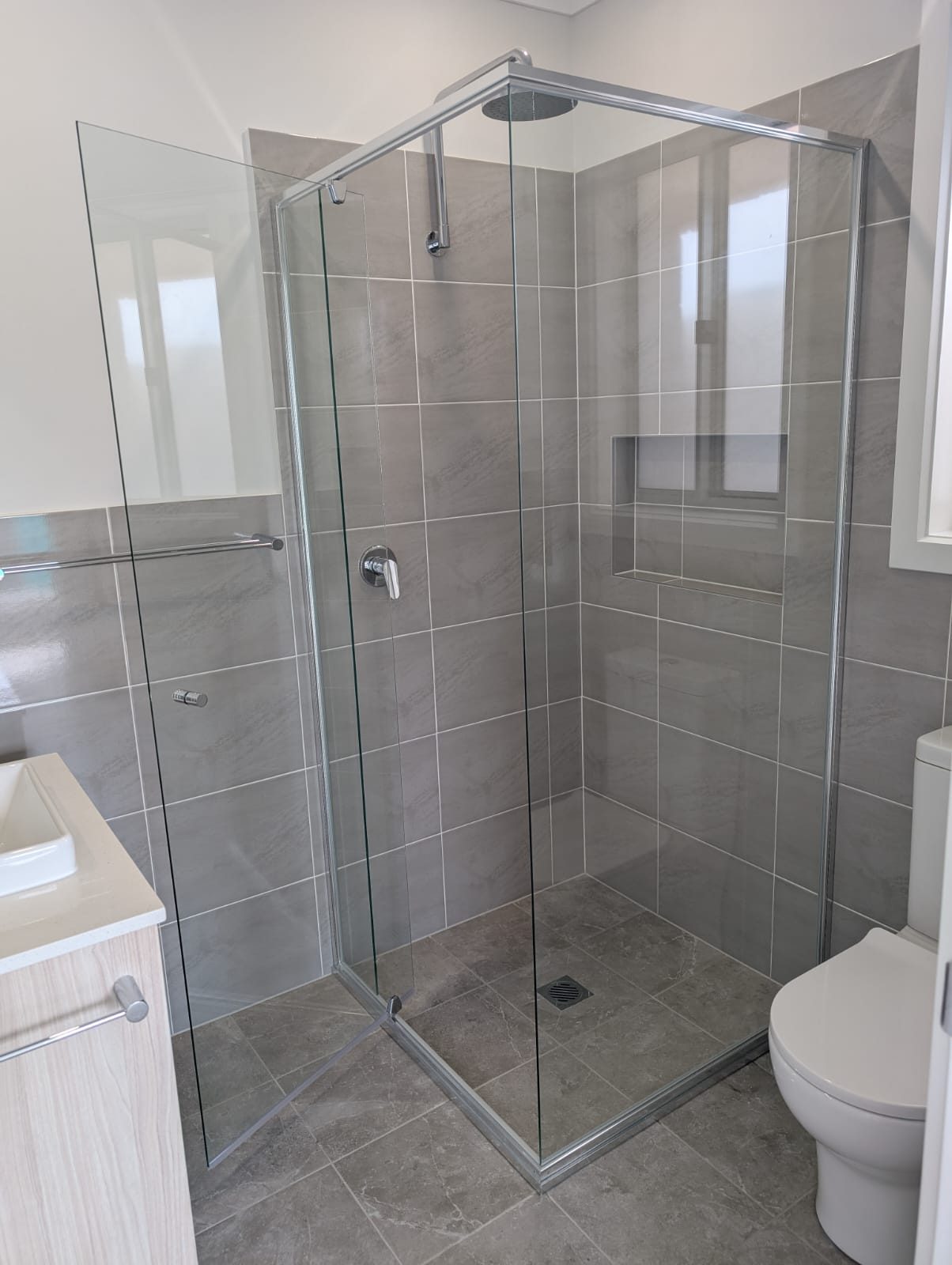 Semi-frameless shower screen with the door open