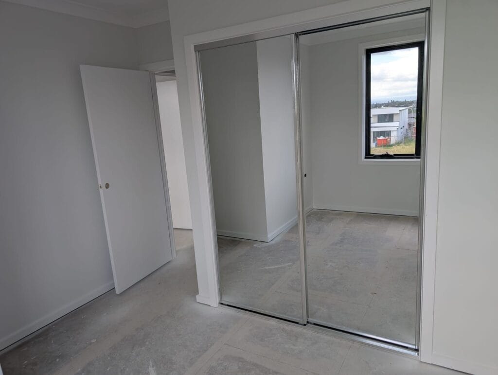 Sliding mirror wardrobe doors silver frame